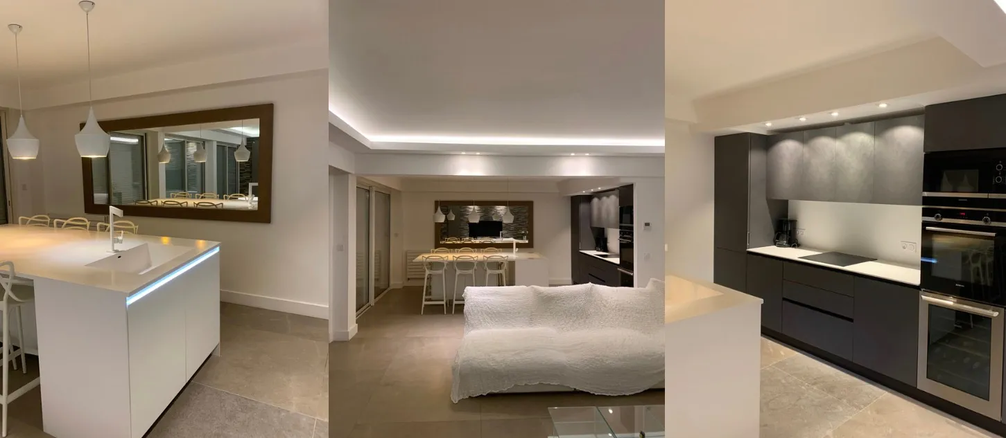 Cuisine, séjour et cuisine noire d’un appartement entièrement rénové à Nice